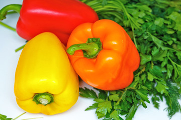 Still life. Food. Ripe peppers and herbs.