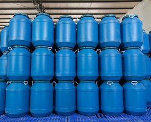 Blue Plastic barrels contain
