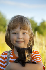 Happy kid with a kitten