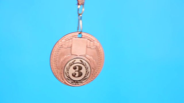  bronze medal on a blue background