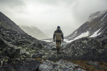 Hiker admiring mountain valley
