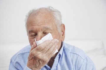 Elderly man with tissues