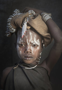 Portrait of girl in tribal face paint