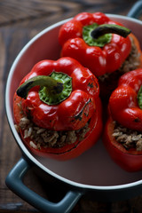 Baking dish with stuffed bell peppers, close-up, selective focus
