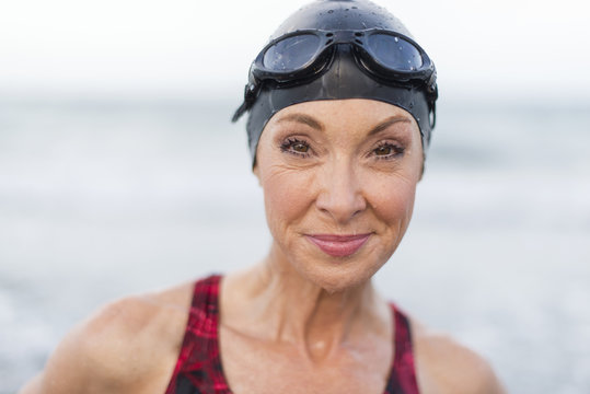 Portrait of female swimmer in cap