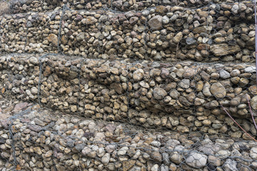 Retaining wall- stones  and metalwire net