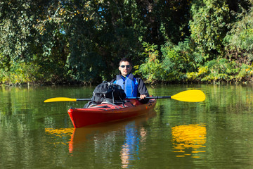 Fototapeta na wymiar The man is kayaking on the river.