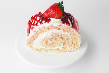 Strawberry cake on white plate