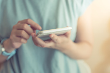 Young woman holding smarthphone in hand