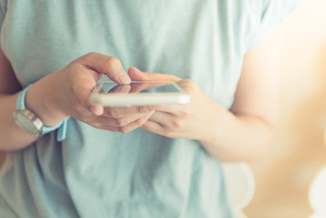 Young woman holding smarthphone in hand