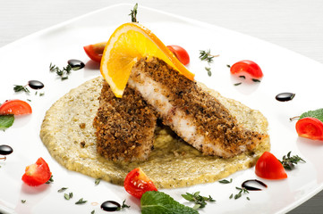 Plate of breaded fish fillets