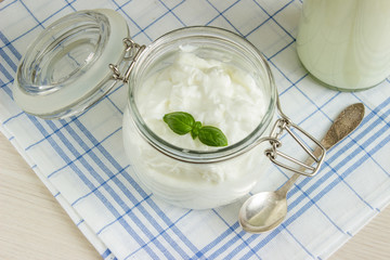 cottage cheese in a jar with basil
