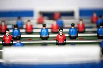 Close up of figures on foosball game set