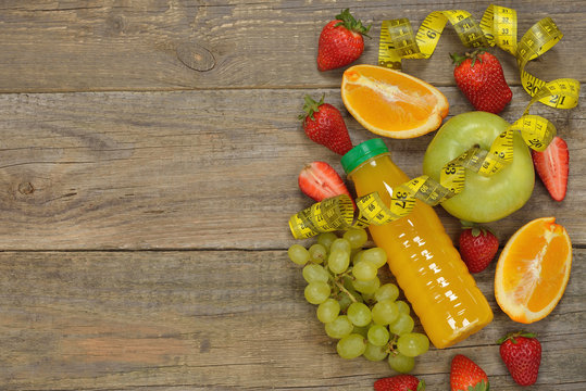 Various fruits on a wooden background