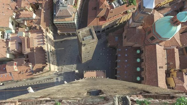 Aerial view by ascending camera from Asinelli tower in Bologna, Italy