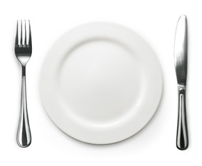 Photo of the fork and knife with white plate on white