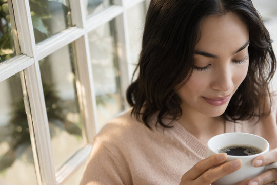 Close Up Of Woman Drinking Cup Of Coffee