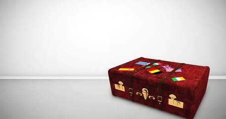 Obraz premium Composite image of suitcase with stickers