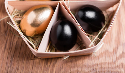 gold and black chicken eggs