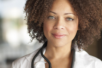 Close up of mixed race doctor smiling