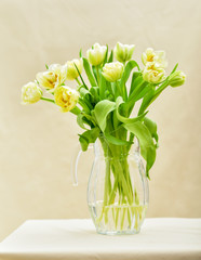 Bright spring bouquet in a vase. Springtime. Vase with tulips.