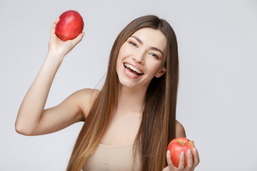 Beautiful Woman with Clean Fresh Skin holding apple