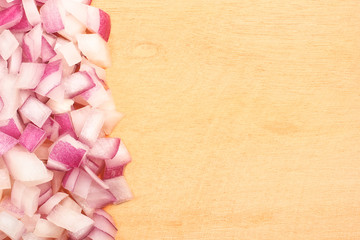Sliced onion on wooden cutting board