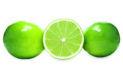 Fototapeta na wymiar Two whole limes and one half lime on white background