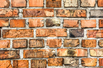 Old brick wall background, aged orange brick texture