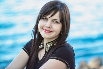 Beautiful smiling girl near the river. Ukraine.
