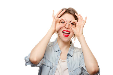 Young happy woman doing finger mask happy white background