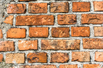 Fototapeta premium Old brick wall background, aged orange brick texture