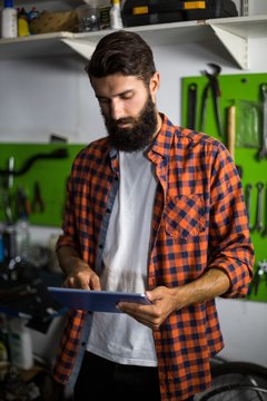 Bike mechanic using tablet computer