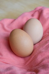 close up egg on pink fabric