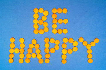 Be Happy, motivation quote. Letteras are mde of little yellow round on blue background