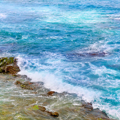 background of ocean waters and coastal stones
