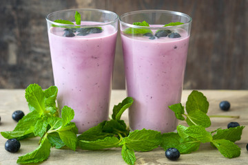 Fresh blueberry smoothie on rustic wood
