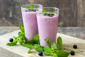 Fresh blueberry smoothie on rustic wood

