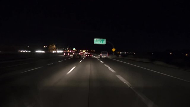 Night highway time lapse going from the city to the country