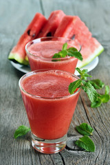 Watermelon juice smoothie and slices