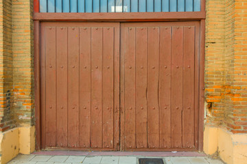 Sheet metal door entrance to a parking