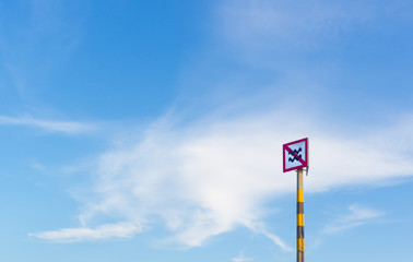 Stop sign in blue sky background