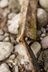 rusty metal on stones