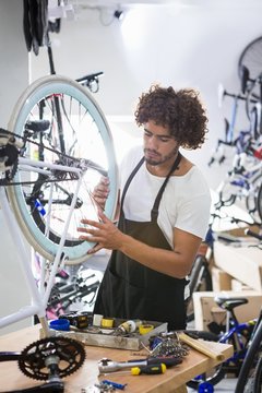 Worker repairing bicycles