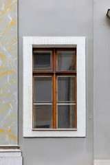 Fototapeta na wymiar A window in the tenement house