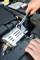 Mechanic Holding Spanner Fixing Car Engine