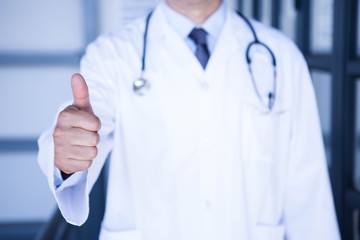 Male doctor showing thumbs up 