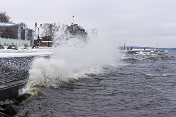 Stormy lake quay in winter
