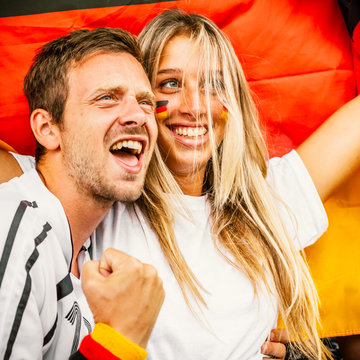 Couple Supporting Germany at the Stadium