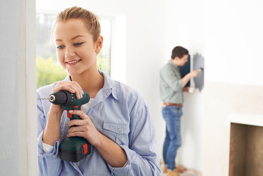 Young Couple Rennovating Property Together